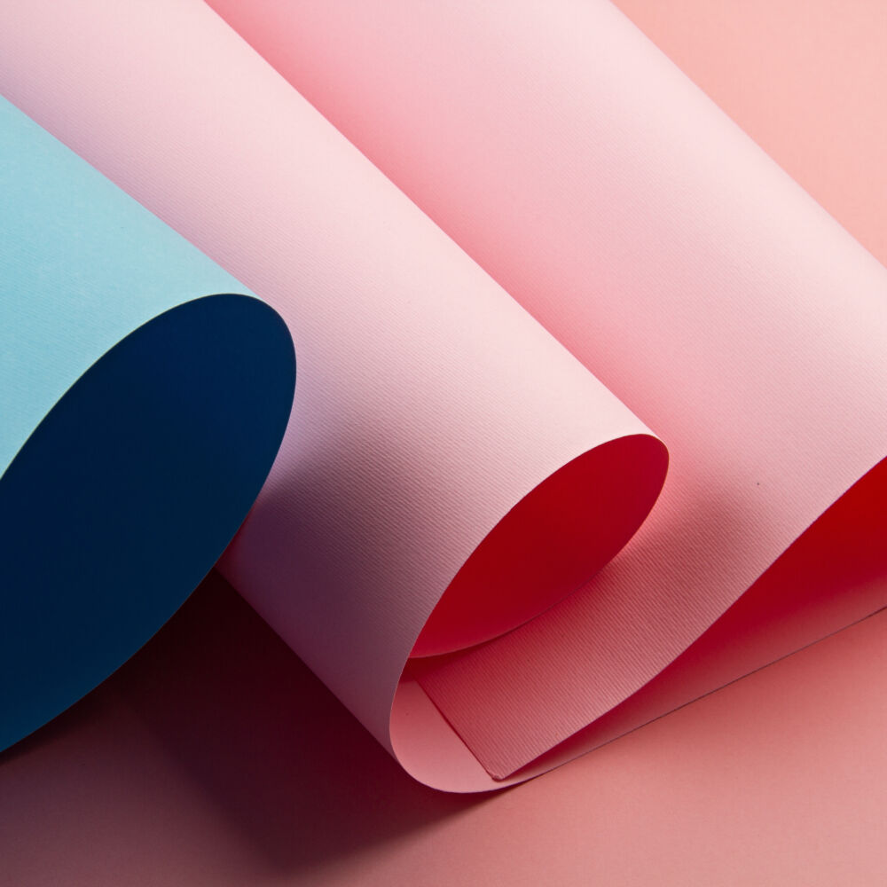 Abstract backgroud of rolled textured paper sheets of different